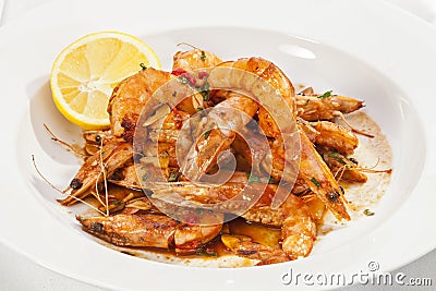 Shrimps prepared with garlic, chili, white wine and balsamic vinegar Stock Photo