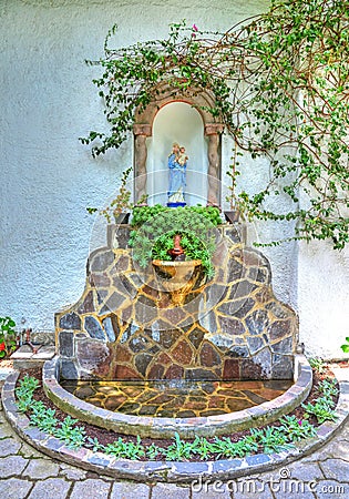 Shrine with a religious statue Stock Photo