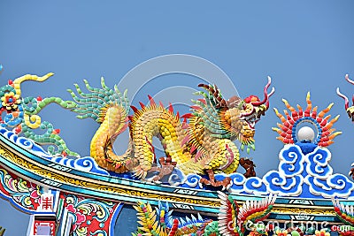 Shrine with statues of dragons and other respectable statues of Chinese art in Thailand Stock Photo