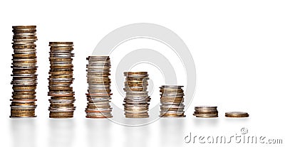 Shrinking stacks of various coins Stock Photo