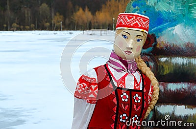 Shrovetide doll in bright folk costume Stock Photo