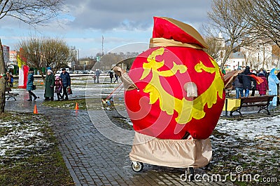 Shrovetide festivities. Large samovar from bright fabric Editorial Stock Photo