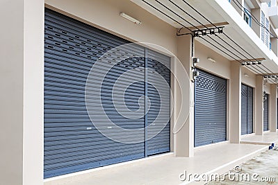 Shutter door or roller door and concrete floor of Commercial Building. Stock Photo