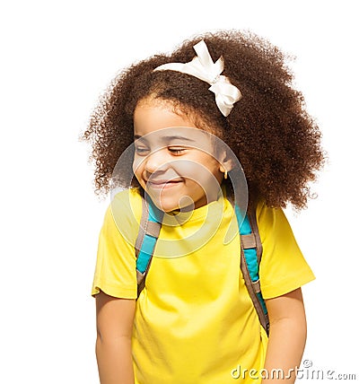 Shy African girl with white bow, closed eyes Stock Photo