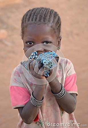 Shy child looking at camera, Burkina Faso Editorial Stock Photo
