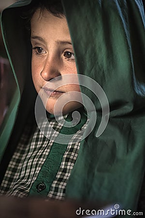 Shy child in the only school in the village of Shimshal 3100m is a government school taught by teachers based in the village Editorial Stock Photo