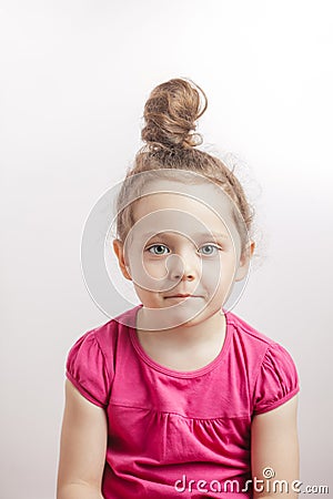 Shy ginger girl with bun Stock Photo
