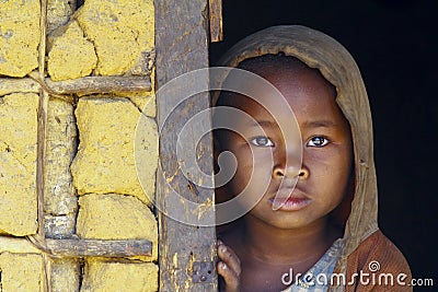 Shy and poor african girl with headkerchief Stock Photo