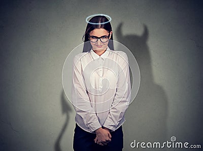 Shy quiet angel woman with devil character Stock Photo