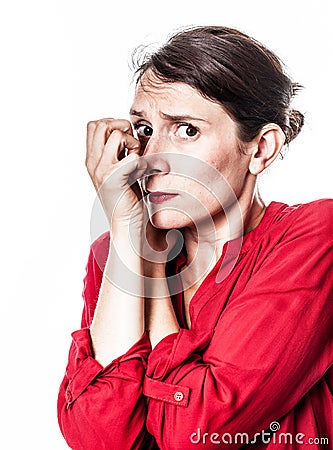 Shy woman protecting herself against frightening anxiety Stock Photo