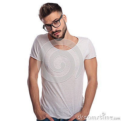 Shy young casual man wearing glasses Stock Photo
