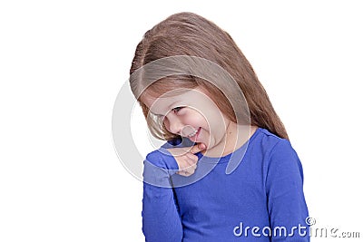 Shying little girl holding finger on chin Stock Photo