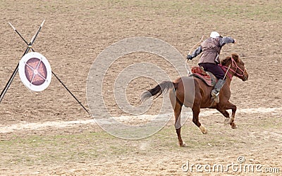 Shymkent, KAZAKHSTAN - 22 March 2017: Celebration of the Kazakh holiday NARIYZ. Archery from a horse Editorial Stock Photo