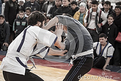 Shymkent, KAZAKHSTAN - 22 March 2017: Celebration of the Kazakh holiday NARIYZ. Competition wrestlers Editorial Stock Photo