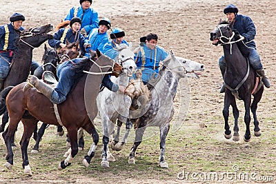 Shymkent, KAZAKHSTAN - 22 March 2017: Celebration of the Kazakh holiday NARIYZ. Competitions on horses Editorial Stock Photo