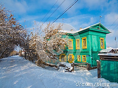 Siberian colored wooden house Stock Photo