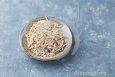 Siberian ginseng Eleutherococcus senticosus on rustic wooden background. Stock Photo