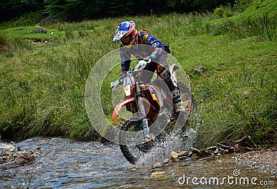 SIBIU, ROMANIA - JULY 16: Unknown competing in Red Bull ROMANIACS Hard Enduro Rally with a KTM 300 motorcycle. The hardest enduro Editorial Stock Photo