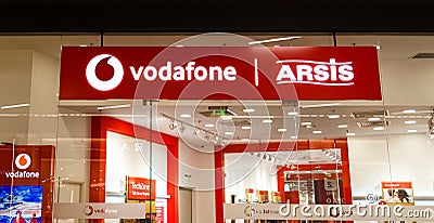 Sibiu, Romania - May, 2 2022: Vodafone and Arsis logo signboard at store front in Promenada Mall, one of the biggest Editorial Stock Photo