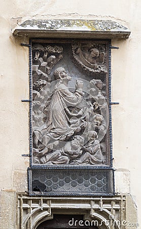Bas-relief closed by a protective mesh on the facade of Lutheran Cathedral of Saint Mary. Sibiu city in Romania Editorial Stock Photo