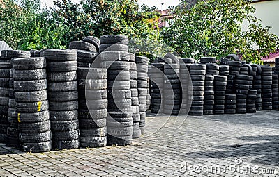 Used tire stacks in Workshop vulcanization yard Editorial Stock Photo