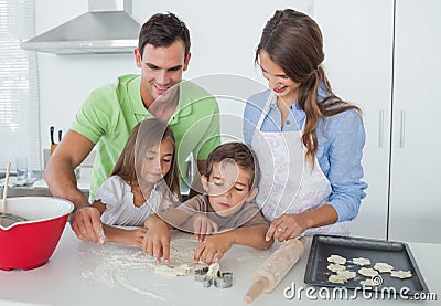 Siblings home baking together in the kitchen Stock Photo