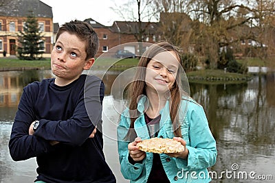 Siblings and one piece of cake Stock Photo