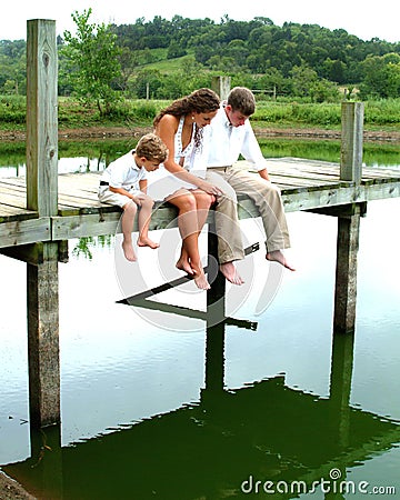 Siblings on pier Stock Photo