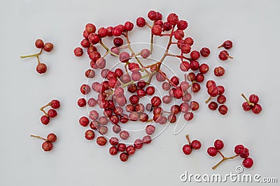 Szechuan pepper, berries and leaves on a white background Zanthoxylum piperitum Stock Photo