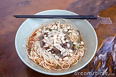 Sichuan style noodles like spicy noodle with chicken gizzard, minced, vegetables and peanut, Chinese cuisine Stock Photo