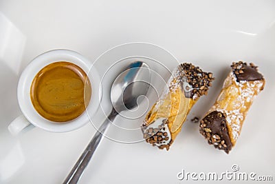 Sicilian Cannoli and coffee on white dish Stock Photo