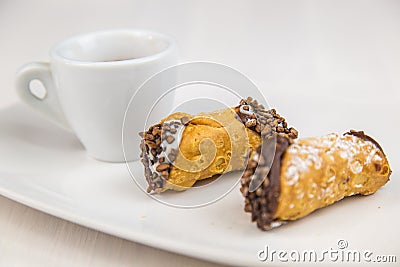 Sicilian Cannoli and coffee on white dish Stock Photo