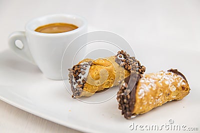 Sicilian Cannoli and coffee on white dish Stock Photo