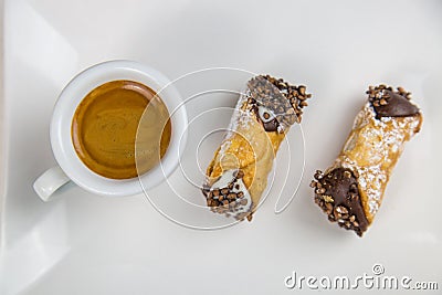 Sicilian Cannoli and coffee on white dish Stock Photo