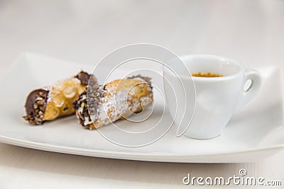 Sicilian Cannoli and coffee on white dish Stock Photo