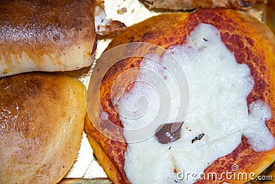 Sicilian Cartocciata, Pizzetta, Cipollina and Arancino. A typical street food from Sicily Stock Photo