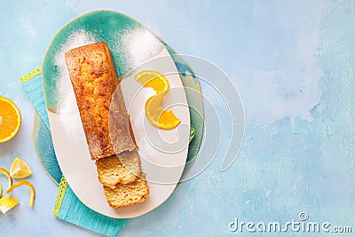 Sicilian orange cake partly sliced and fresh citrus fruits Stock Photo