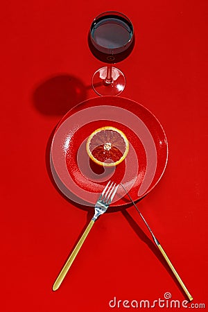 Sicilian orange cut in half on a red plate. Top view. Copy space. Creative concept Stock Photo