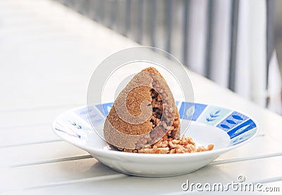 Sicilian snack, fried ball of rice arancino on a plate, tipical street food of Sicily Stock Photo