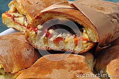 Sicilian street Italian food: pane cunzato. Tomato, pecorino sandwich Stock Photo