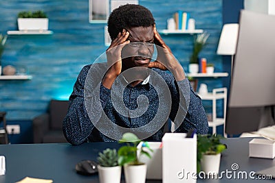 Sick african american guy stressing about deadline Stock Photo