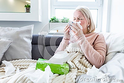 Sick Albino Woman.Flu.Woman Caught Cold. Sneezing into Tissue. Headache. Virus .Medicines. Young Woman Infected With Cold Blowing Stock Photo