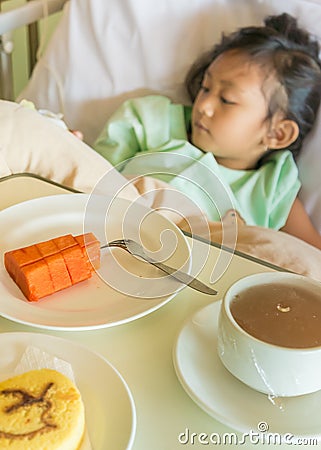 Sick Asian Child Hospital Patient on Bed with Breakfast Meal Menu Stock Photo