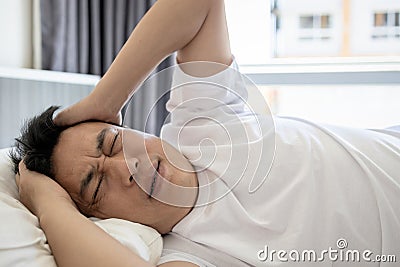 Sick asian middle aged man with severe headache,Increased intracranial pressure,brain tumor,painful within the skull,male patient Stock Photo
