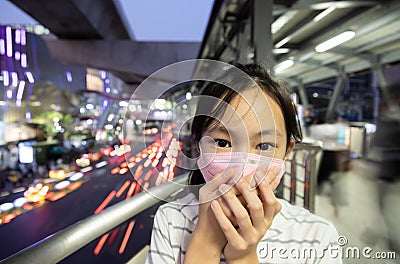 Sick asian people wearing protective mask,child girl has cough,choking on air pollution,problems of toxic dust,smog,fine dust,air Stock Photo