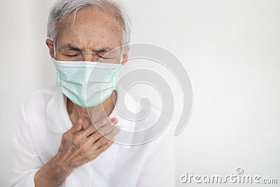 Sick asian senior woman having difficulty breathing,patient suffering from pain in chest feel tight,acute dyspnea,asthma,shortness Stock Photo