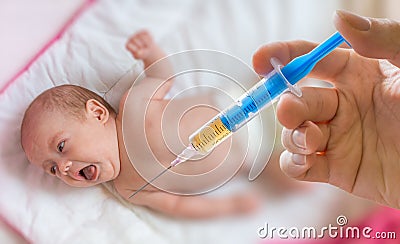 Sick baby is yelling and scared from injection Stock Photo