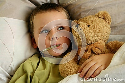 Sick child. Ill boy with fever Stock Photo