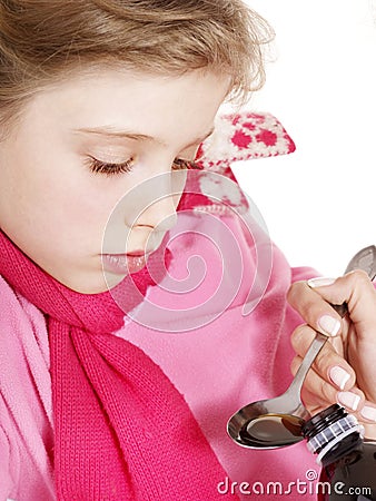 Sick child take medicine. Isolated. Stock Photo