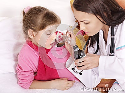 Sick child take medicine. Isolated. Stock Photo